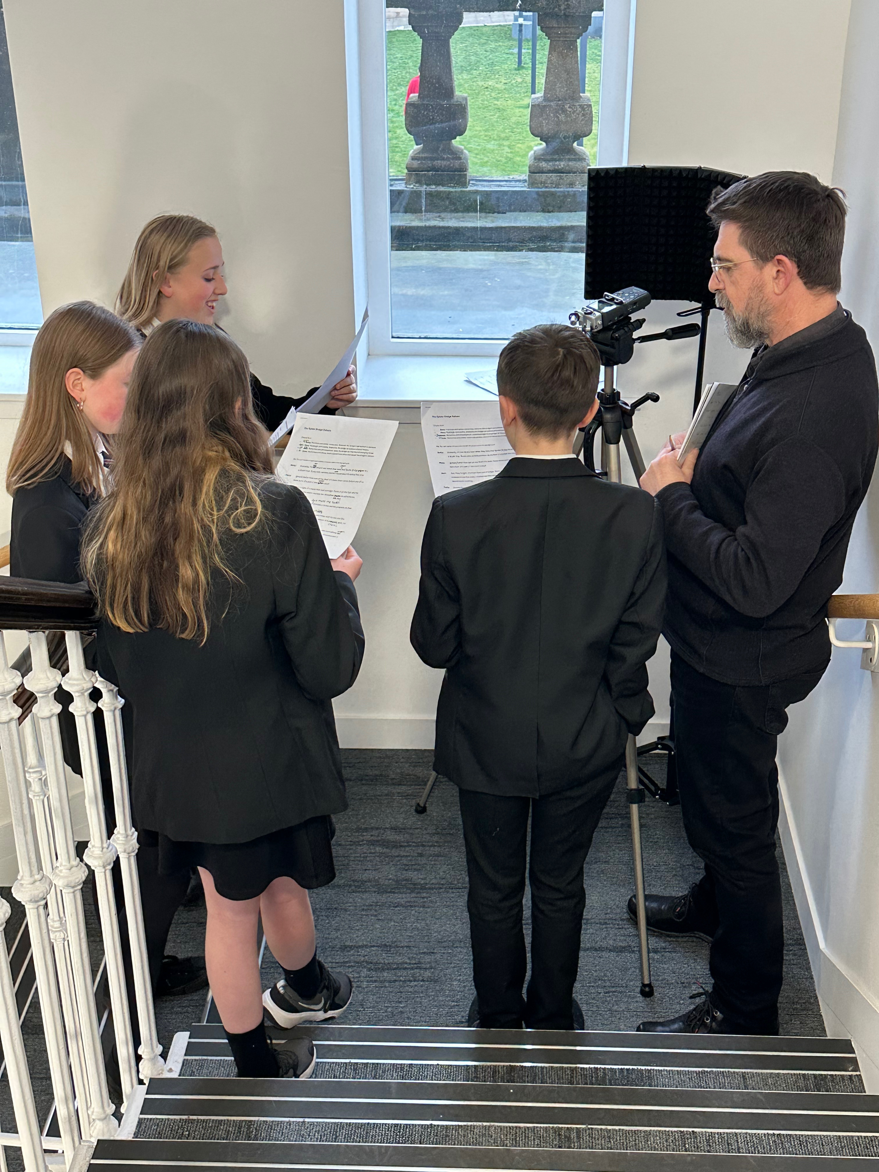 education consultant, Douglas and pupils recording a script