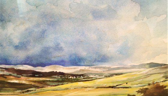 A watercolour painting which shows green, open countryside leading to hills in the background under a blue sky dotted with white clouds