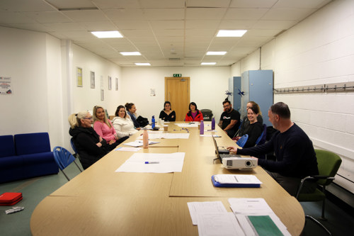 Volunteers sitting around a table
